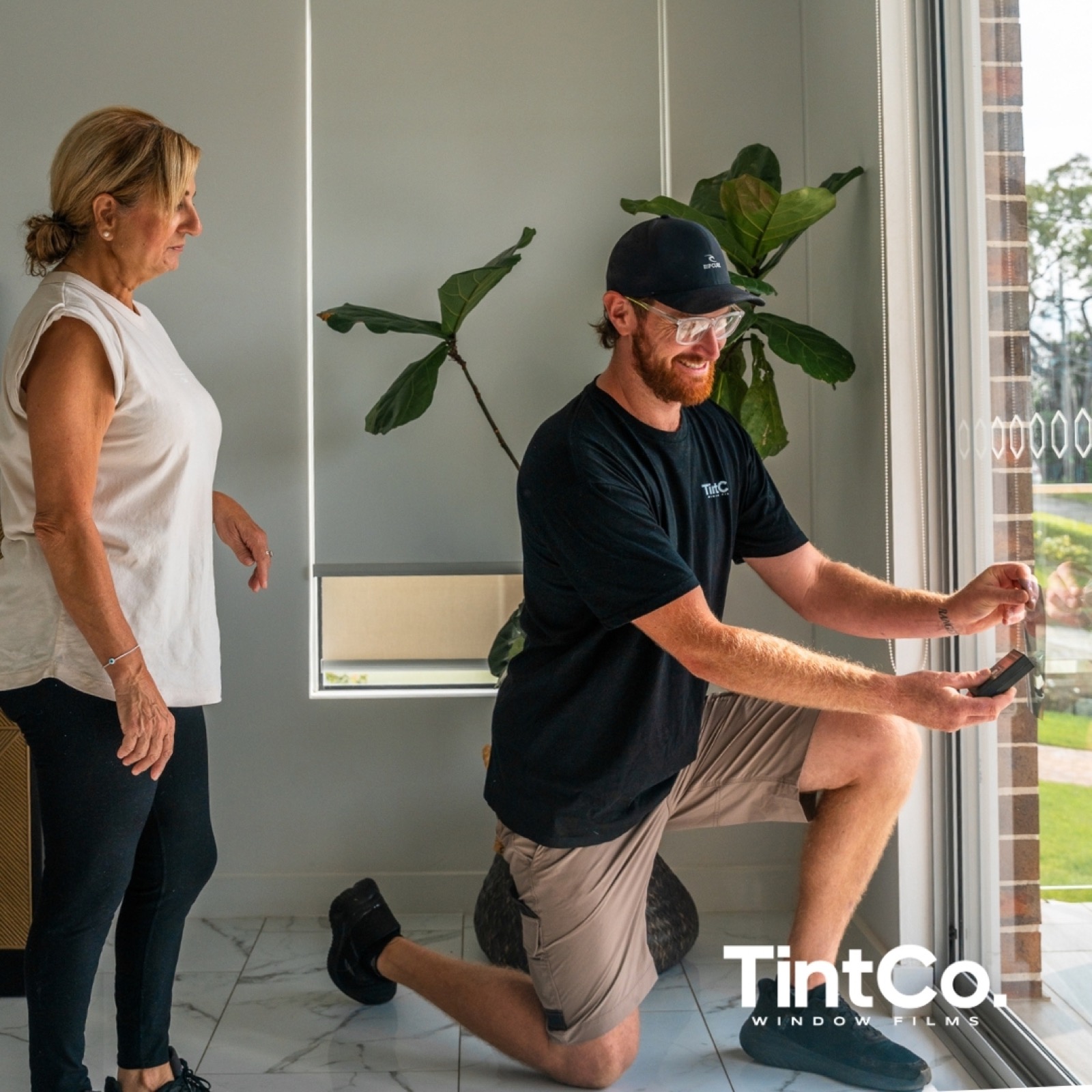 TintCo installer talking a client through film options